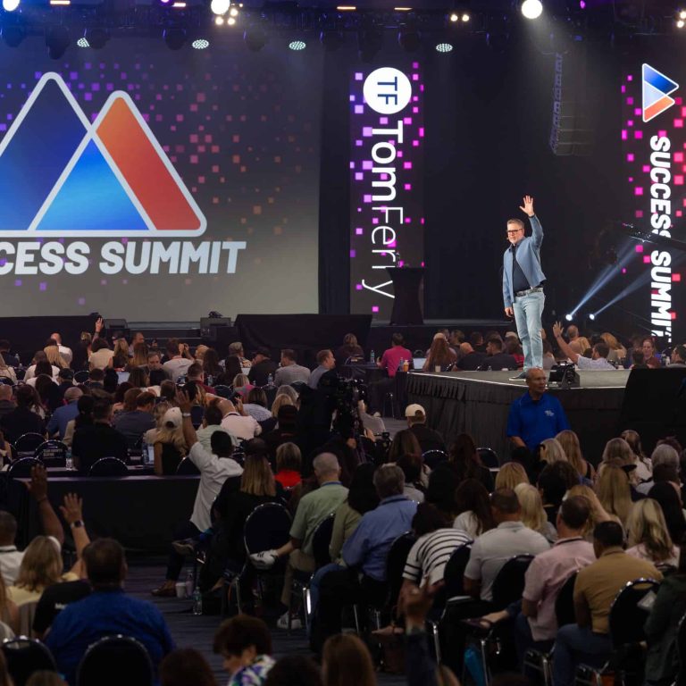 Tom Ferry, CEO of Tom Ferry Coaching, on stage at his annual Success Summit